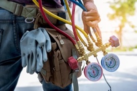 An HVAC technician on their way to diagnose and repair your heating and cooling systems.
