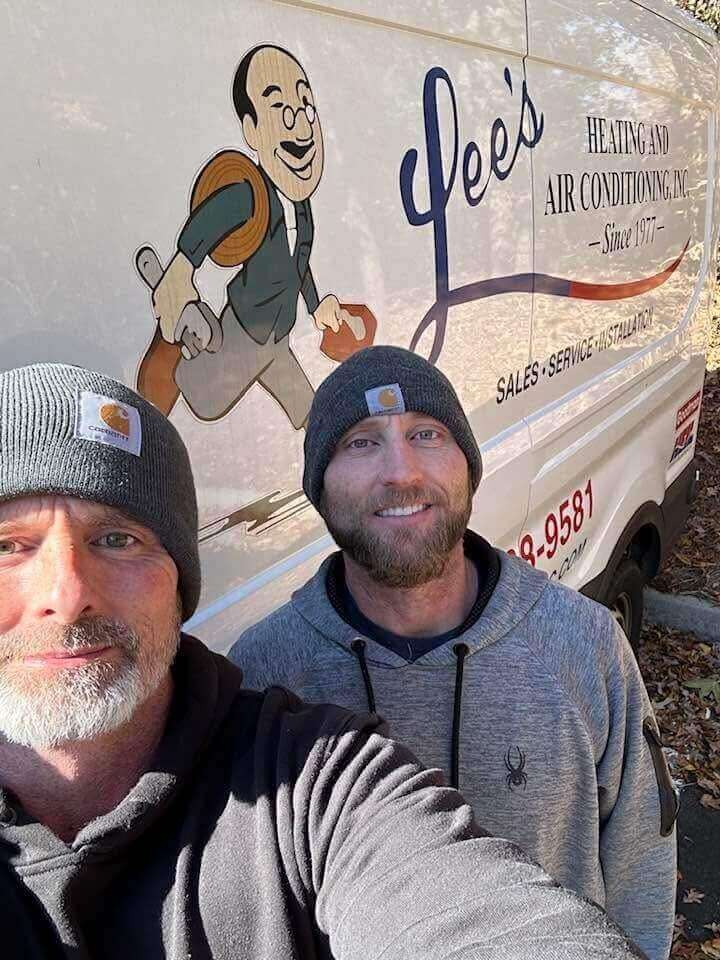 Lee's Heating and Air technician performing furnace repair in a Monroe, GA home